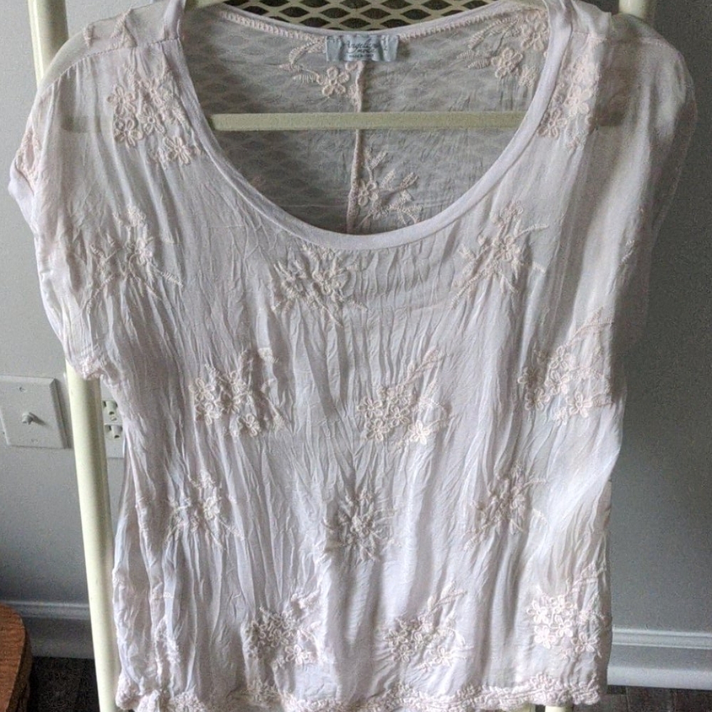 Pink crinkle top with attached tank underneath.